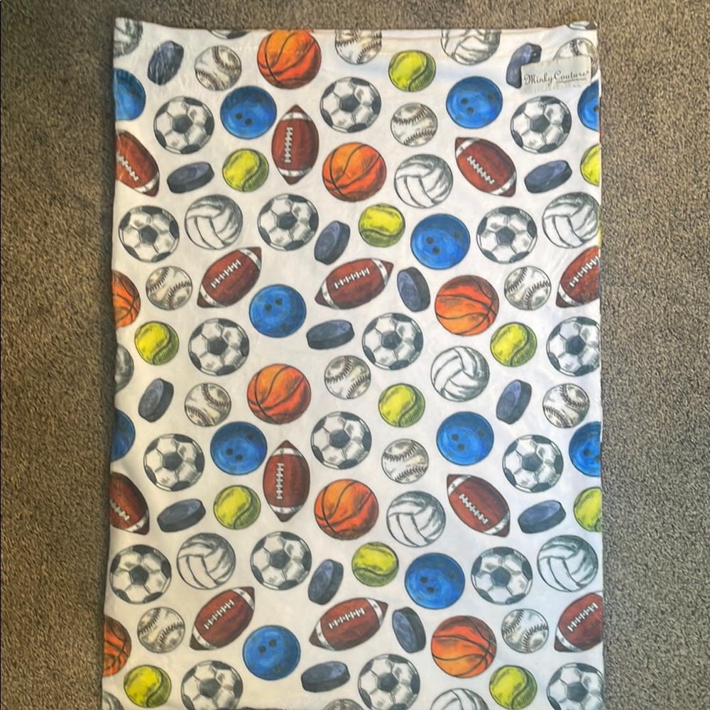 NWOT standard pillowcase from Minky Couture.  Theme is sports